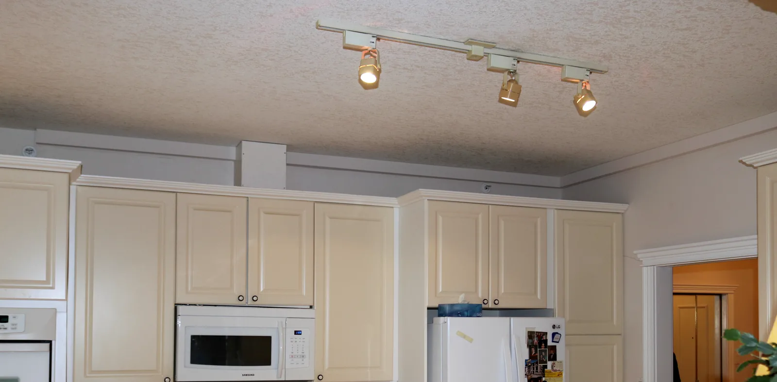 Plumbing Track route coordinated above cabinets in an occupied suite