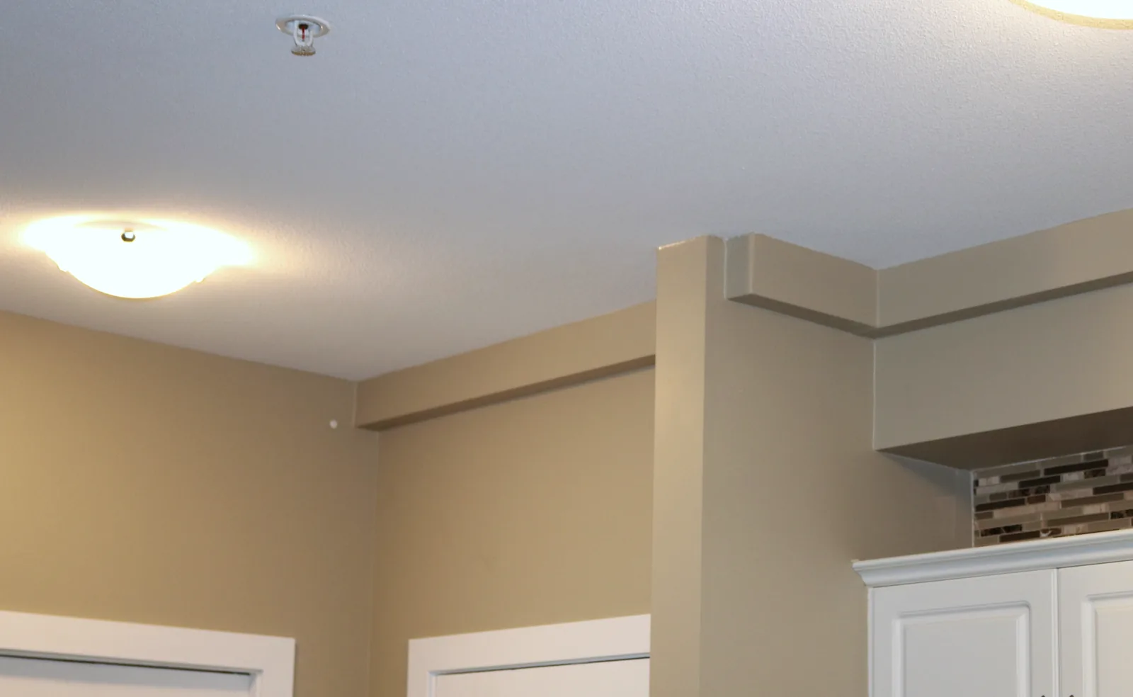 Planned Plumbing Track replacement route along a finished ceiling transition