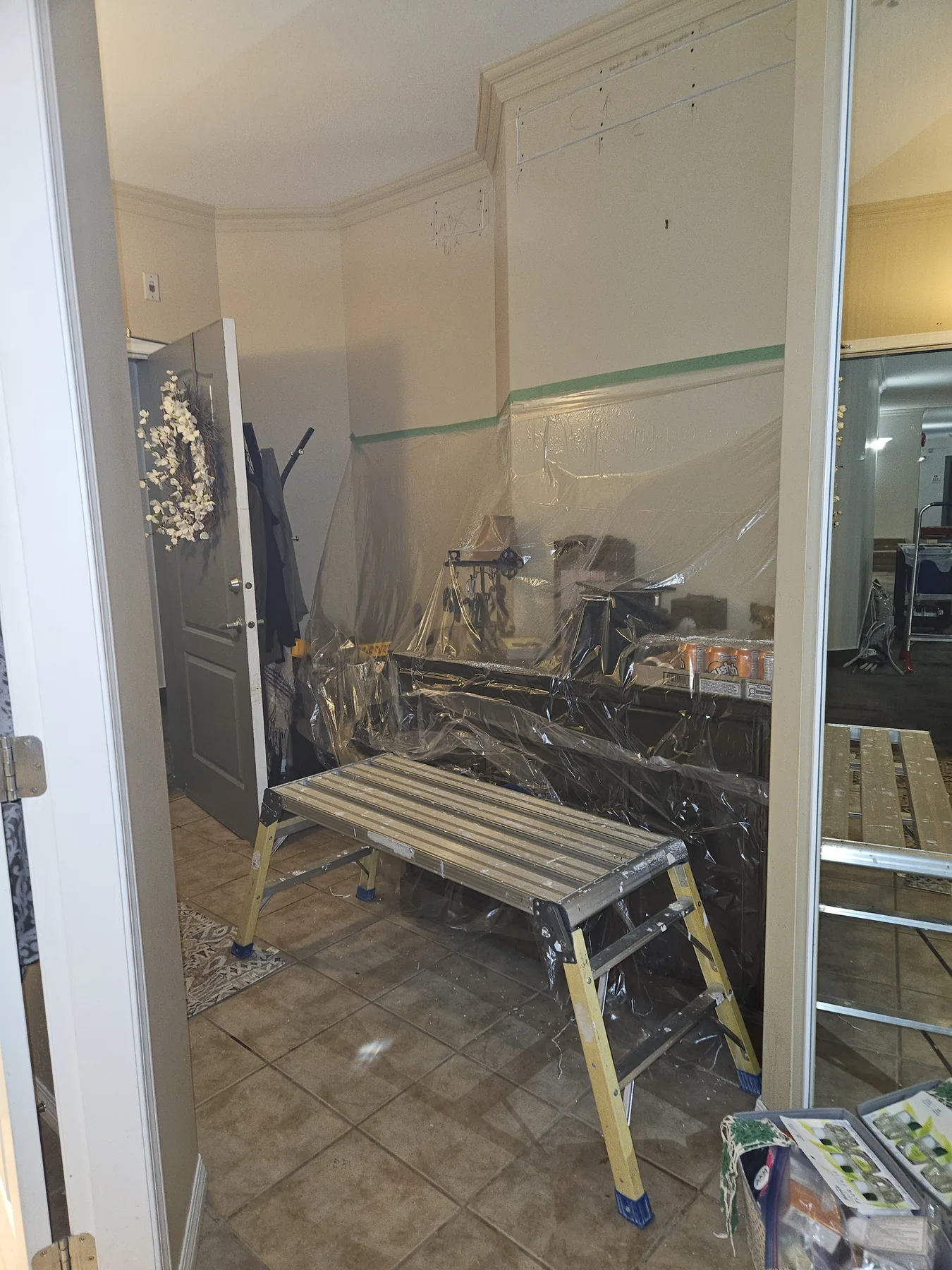 Plumbing Track installation underway inside an occupied suite with protection in place